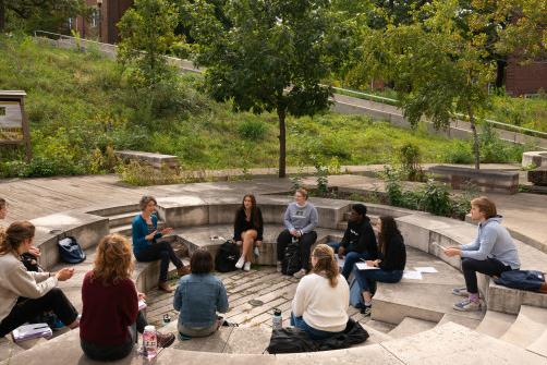 Student's enjoying class outside on the Sanger Science Center courtyard.