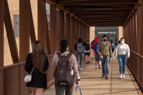 Students walking across the Powerhouse bridge.